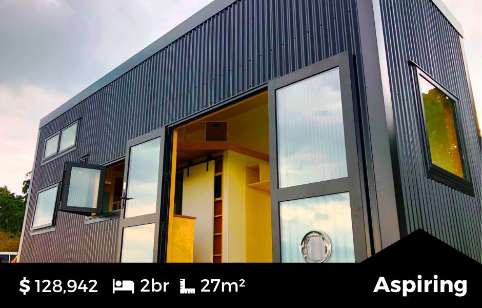 The Aspiring Tiny Home by Fox Cabins, Raglan. Downstairs Bedroom and Large Mezzanine, Full Kitchen and Bathroom. Ebony Black Colorsteel Cladding.